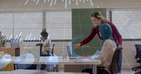 Financial Data Processing in Modern Office with Diverse Team