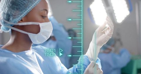 Surgeon Preparing for Procedure with Digital Interface Overlay