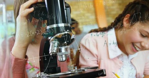 school students laughing using microscope in science class - Download Free Stock Images Pikwizard.com