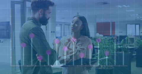 Colleagues Analyzing Data Using Tablet and Stylus with Graph Overlay in Office