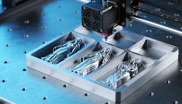 CNC milling spindle carving metal relief figurines on fixture plate, gantry precision
