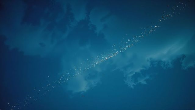 Golden celestial chain illuminating blue night sky
