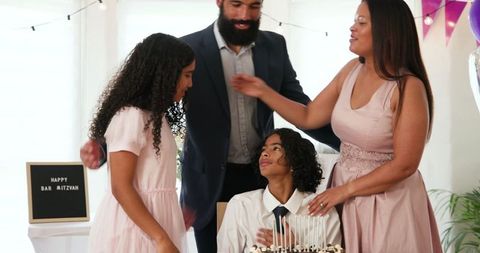 Family Celebrating Bar Mitzvah with Joy and Love at Home