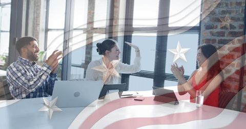 Diverse Business Team Celebrating Success with American Flag