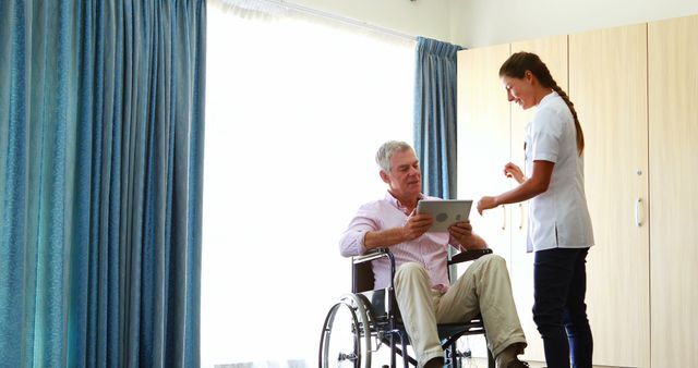 Caregiver Assisting Elderly Man in Wheelchair at Health Facility - Download Free Stock Images Pikwizard.com