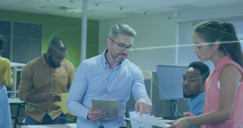 Team collaborating in modern tech-driven office
