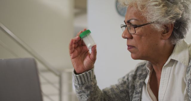 Senior Woman Checking Medicine Bottle at Home - Download Free Stock Images Pikwizard.com