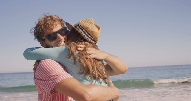 Happy Couple Embracing on Beach During Sunny Day - Download Free Stock Images Pikwizard.com