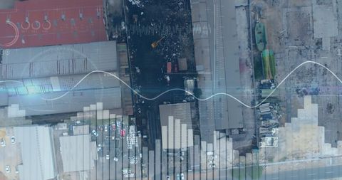 Aerial View of Industrial Buildings with Digital Global Data Overlay