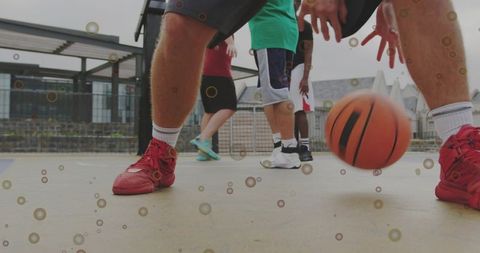 Close-up dribbling on urban rooftop court with red sneakers, crew socks and basketball