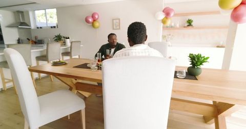 Friends Gathering in Modern Living Room Sharing Laughter and Salad