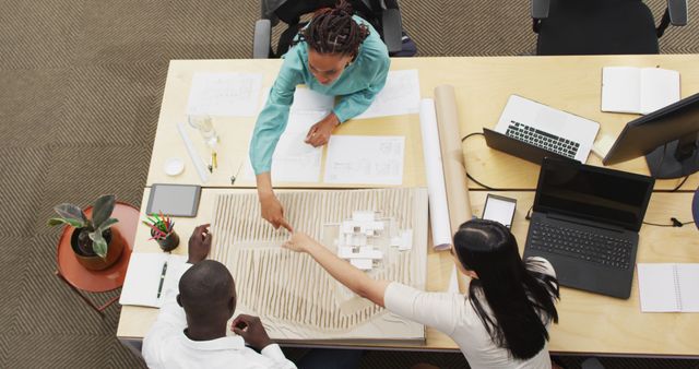 Team Collaborating on Architectural Project in Office - Download Free Stock Images Pikwizard.com