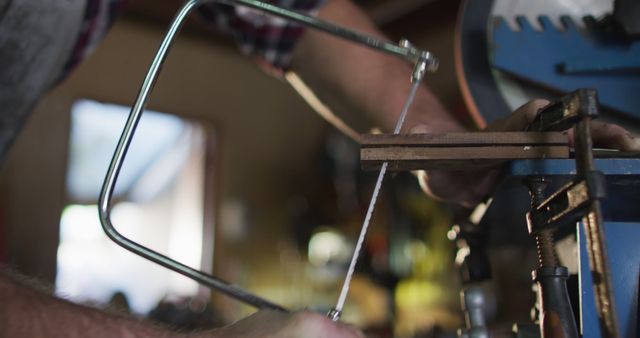 Close-Up of Craftsman Cutting Wood with Coping Saw in Workshop - Download Free Stock Images Pikwizard.com