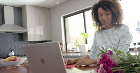 Woman Having Valentine's Day Video Call with Laptop in Kitchen