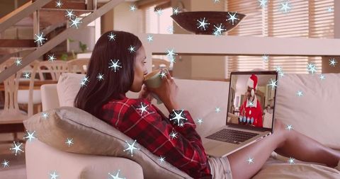 Woman Enjoying Virtual Christmas Call with Santa
