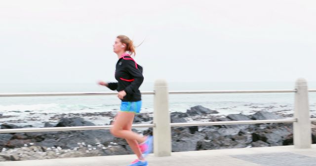 Woman Jogging Along Seaside Path in Running Gear - Download Free Stock Images Pikwizard.com