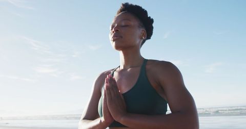 African Woman Meditating Peacefully on Sunny Beach - Download Free Stock Images Pikwizard.com