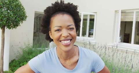 Joyful African American Woman in Lush Garden Environment