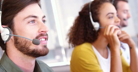Diverse Customer Service Team Wearing Headsets in Professional Office - Download Free Stock Images Pikwizard.com