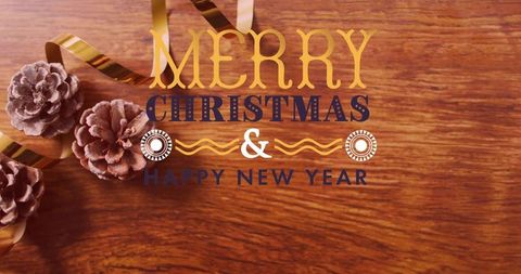 Rustic gold and navy holiday typography on woodgrain with dusted pine cones and ribbon