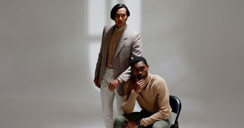 Diverse male models posing in minimalist neutral fashion