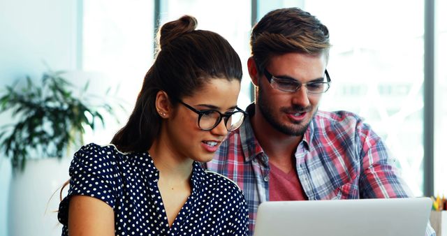 Young Professionals Collaborate on Laptop in Modern Office - Download Free Stock Images Pikwizard.com