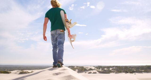 Man with Skateboard Walking on Sand Dunes under the Sun - Download Free Stock Images Pikwizard.com