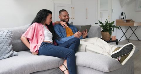 Happy Couple Sharing Pregnancy News at Home