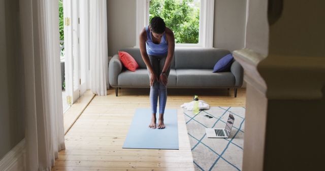 Woman Practicing Yoga at Home with Laptop in Living Room - Download Free Stock Images Pikwizard.com