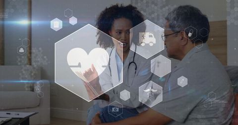 Telemedicine clinician explaining heart health on tablet in patient home with digital icons