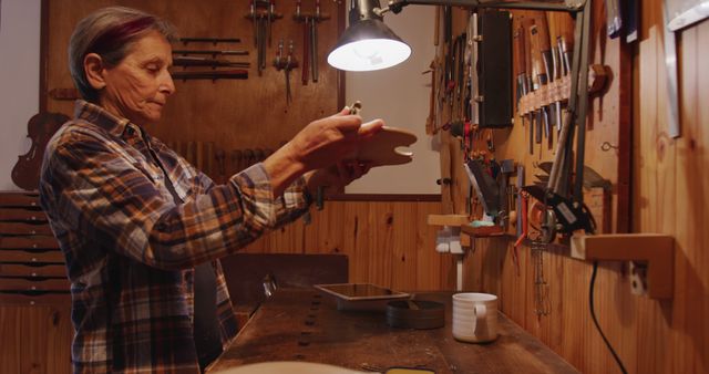 Senior Woman Crafting Wooden Object in Workshop - Download Free Stock Images Pikwizard.com