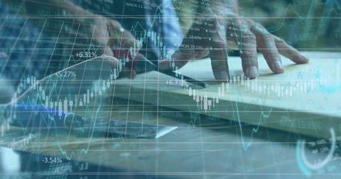 Business Hands Planning with Financial Chart Overlay