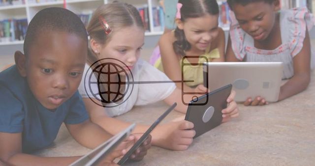 Diverse children exploring tablets in educational library