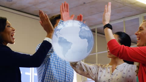 Diverse Team Celebrating Success with Global Networking Concept