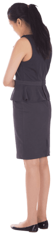 Transparent full-length view of biracial businesswoman standing thoughtfully