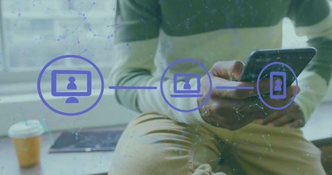 Man holding smartphone and tapping screen while sitting on bench with device sync icons overlay