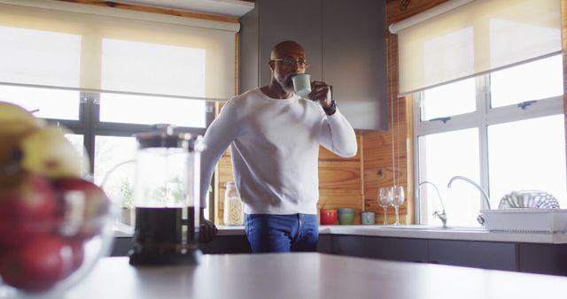 Man Enjoying Morning Coffee at Home in Modern Kitchen - Download Free Stock Images Pikwizard.com