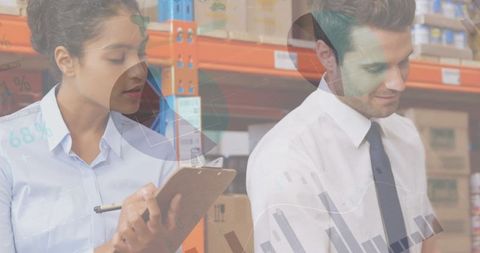 Business analysts reviewing data in warehouse setting