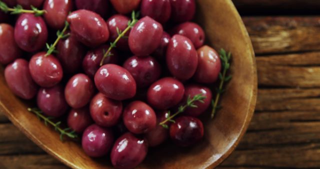 Close-up of Fresh Red Olives in Wooden Bowl - Download Free Stock Images Pikwizard.com