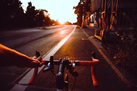 Cyclist Enjoying Scenic Sunset during Evening Ride