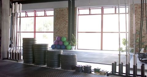 Well-Equipped Gym Filled with Natural Light for Workout Inspiration