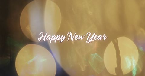 Happy New Year Celebratory Yellow Bokeh Lights