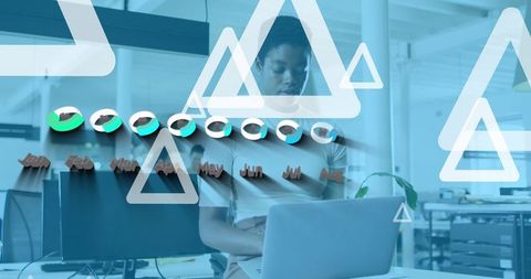 Businesswoman Analyzing Data with Futuristic Graphs in Modern Office