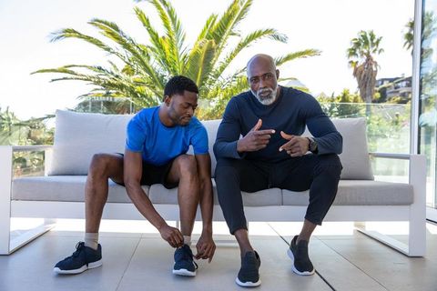 Athletic Father and Son Bonding on Terrace