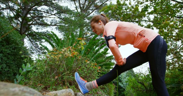 Woman Stretching Legs in Park Before Running - Download Free Stock Images Pikwizard.com