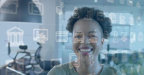 Smiling businesswoman interacting with holographic finance dashboard in modern office