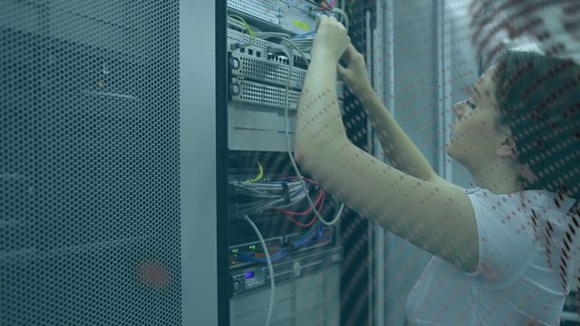 Female engineer is working on server maintenance in a data center. She is handling cables and network connections. This video can be used to highlight technical careers, IT infrastructure, and data management. Suitable for articles on technology, network administration, and digital security.