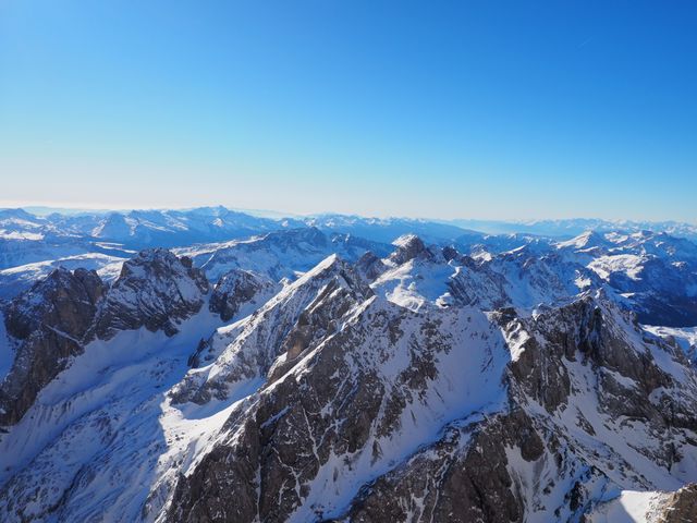 Snow-Covered Mountain Range Under Clear Blue Sky - Download Free Stock Photos Pikwizard.com