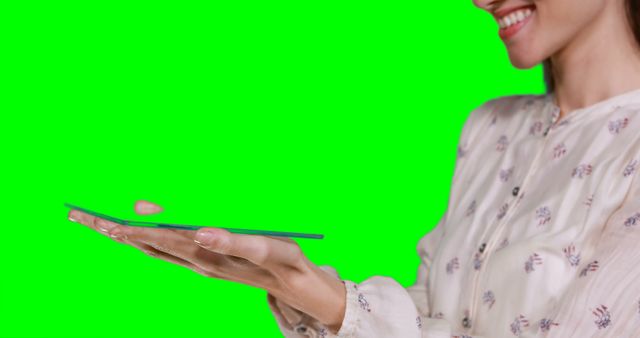 Woman Holding Device on Green Screen Background - Download Free Stock Images Pikwizard.com