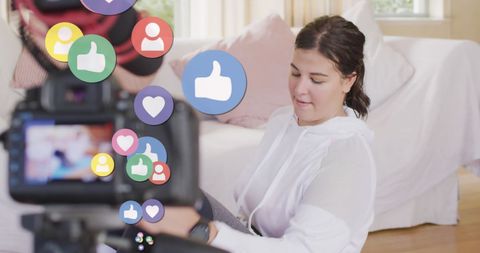 Vlogger engaging with social media insights at home